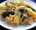 A plate of traditional Algerian rechta served with noodles, zucchini and potatoes.
