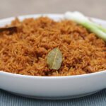 Nigerian jollof rice on a white plate