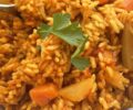 Burkunabe ris gras is rice cooked in seasoned tomato sauce with chicken