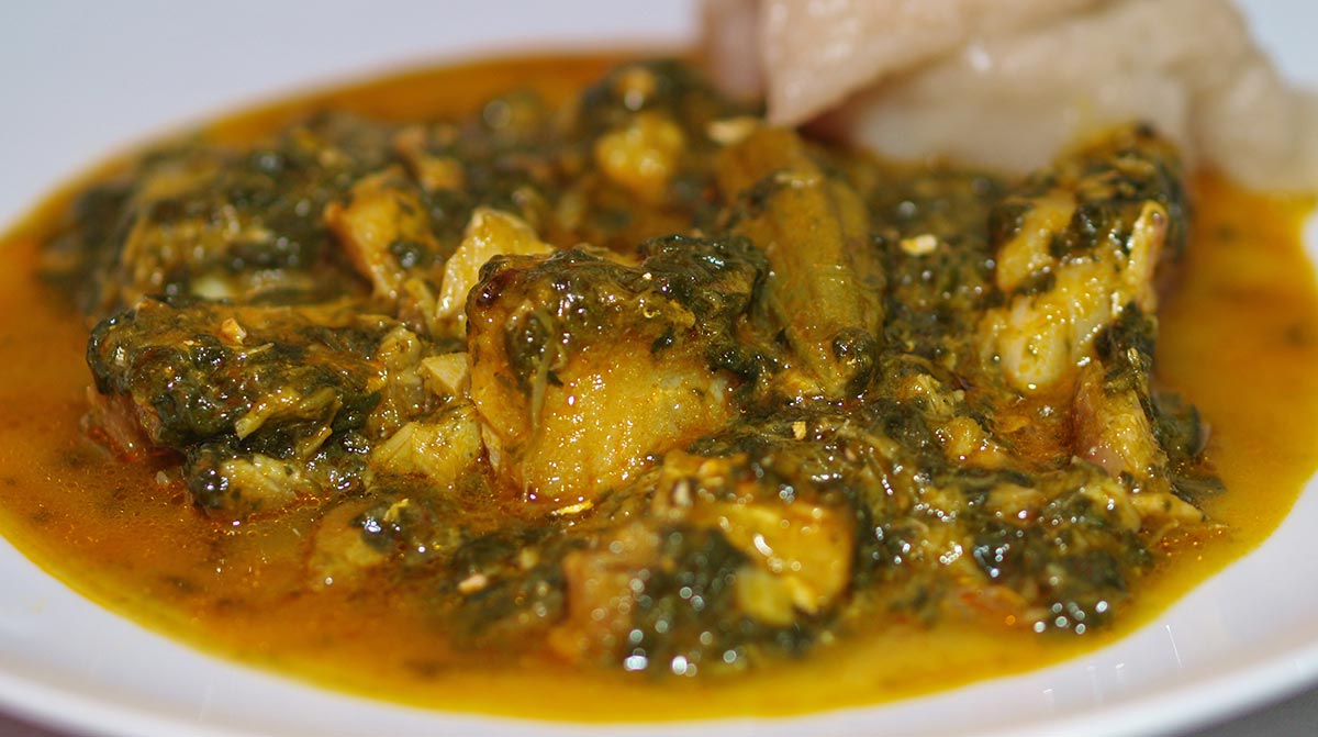 São Toméan fish and vegetable stew with okra, leafy greens, and red palm oil
