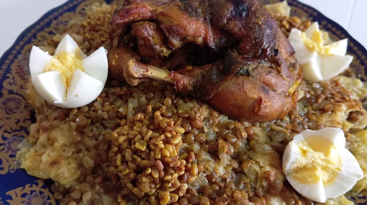 Moroccan chicken rfissa with lentils and shredded msemen, garnished with boiled eggs